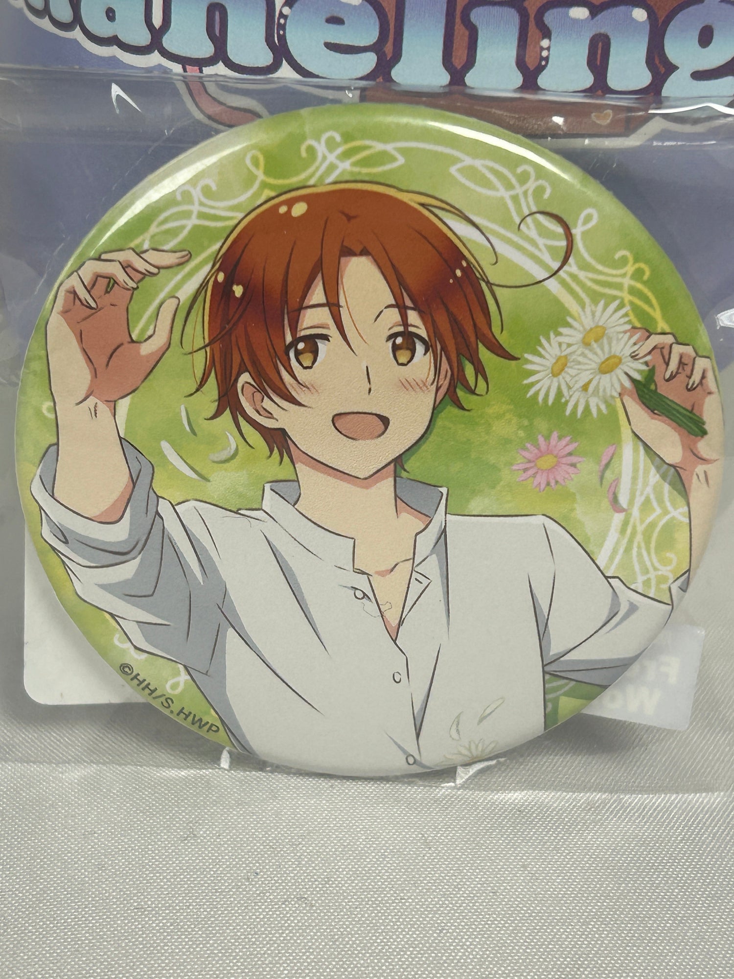 Italy from hetalia in a white shirt holding a flower on a green button badge for the Hetalia collection page