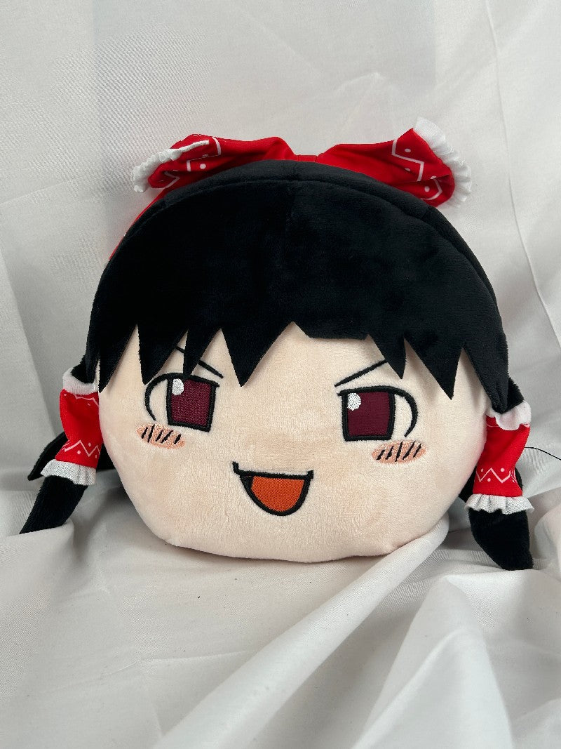 Reimu Hakurei plush circle toy with brown hair and a red bow with a smiling expression for the Touhou Series collection page