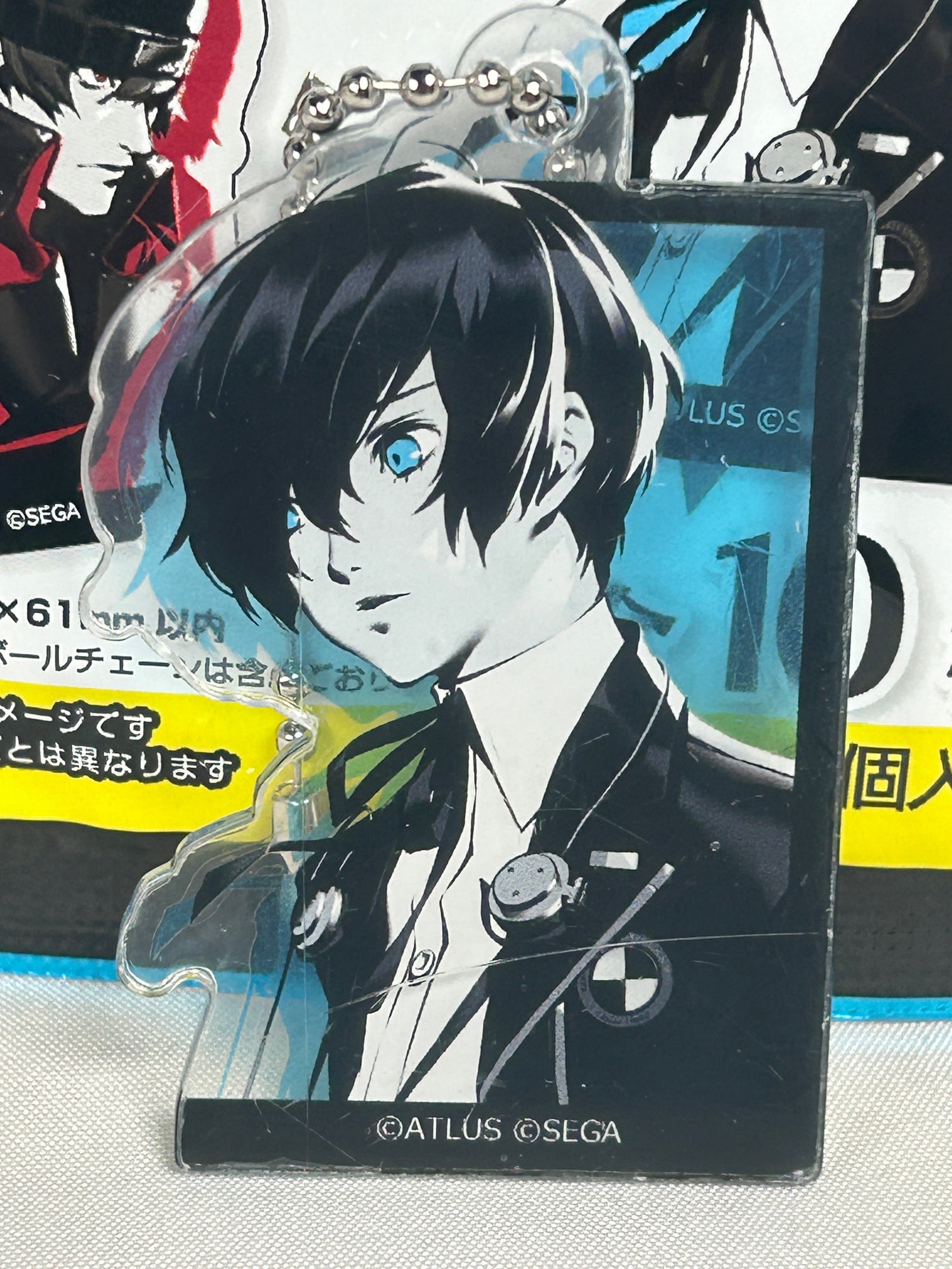 Makoto Yuki on a Blue background acrylic keychain for the Persona Series Keychain Collection page