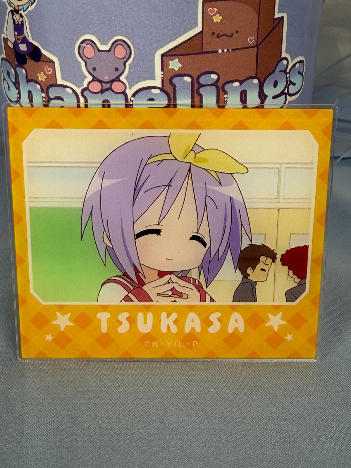 Tsukasa Hiiragi Smiling Acrylic Art Trading Card Lucky Star Anime Scene